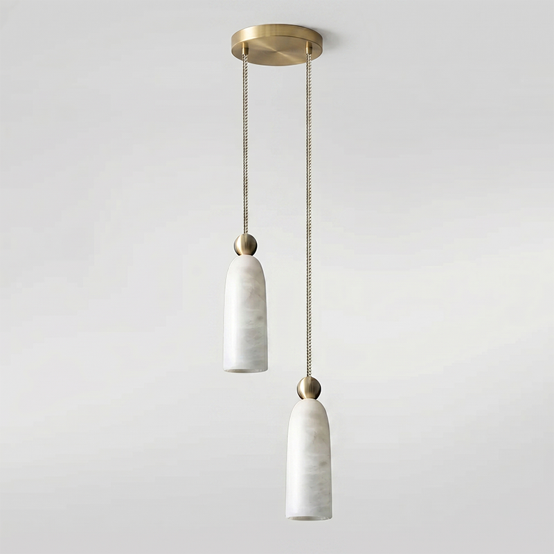 A single Figure pendant casting soft light on a wooden surface below.