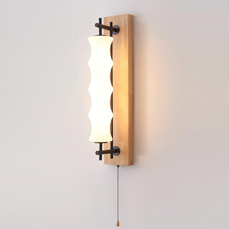 The Nesta wall sconce providing ambient light in a minimalist hallway.