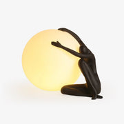 Cosmo Humanoid Ball Holding Table Lamp-Neutral Decor