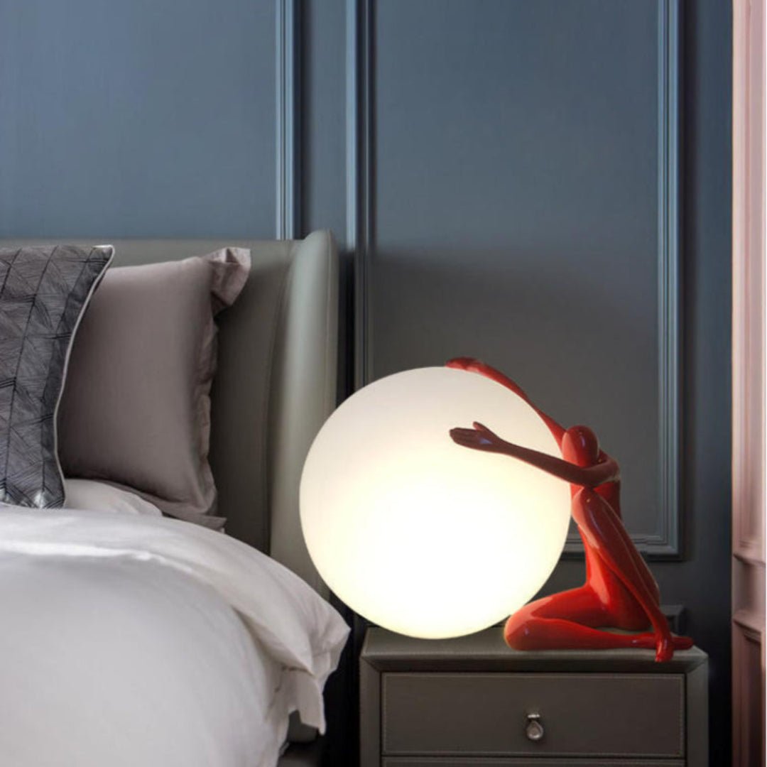 Cosmo Humanoid Ball Holding Table Lamp-Neutral Decor