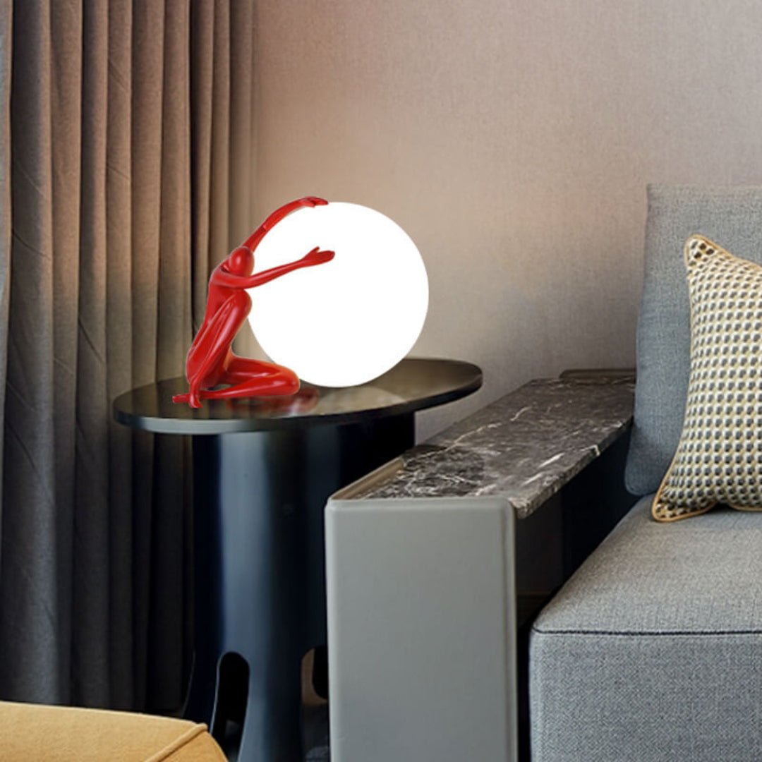 Cosmo Humanoid Ball Holding Table Lamp-Neutral Decor