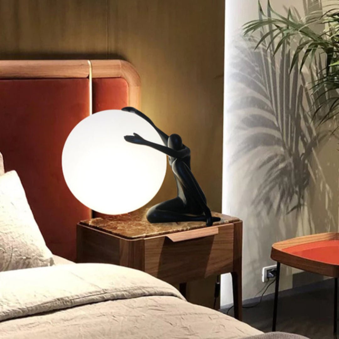 Cosmo Humanoid Ball Holding Table Lamp-Neutral Decor