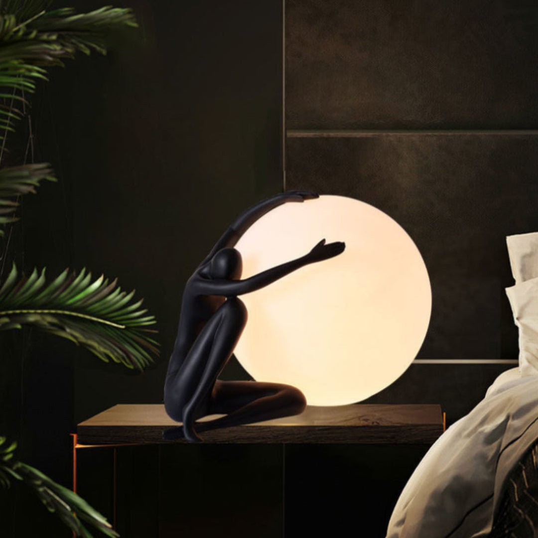 Cosmo Humanoid Ball Holding Table Lamp-Neutral Decor