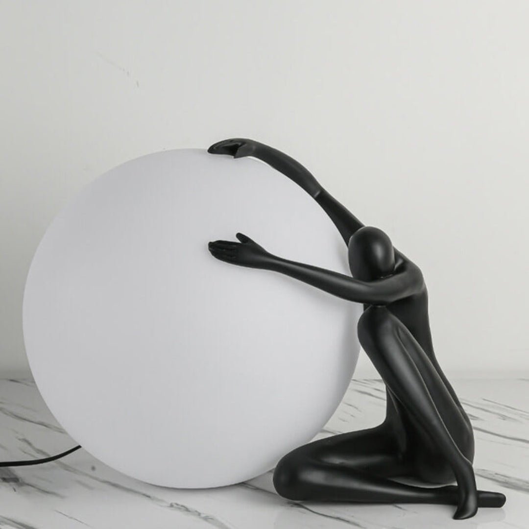 Cosmo Humanoid Ball Holding Table Lamp-Neutral Decor