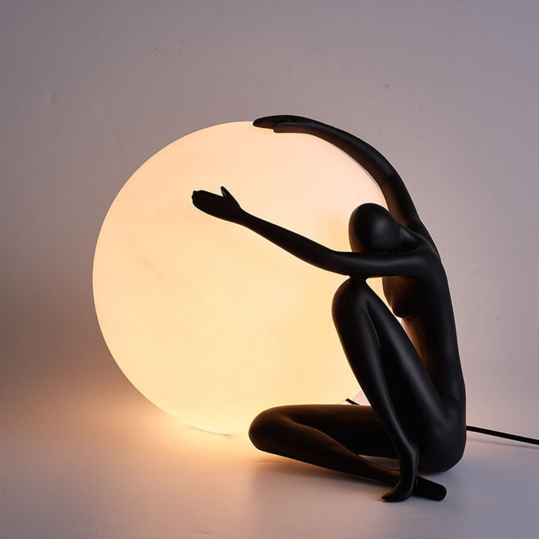 Cosmo Humanoid Ball Holding Table Lamp-Neutral Decor