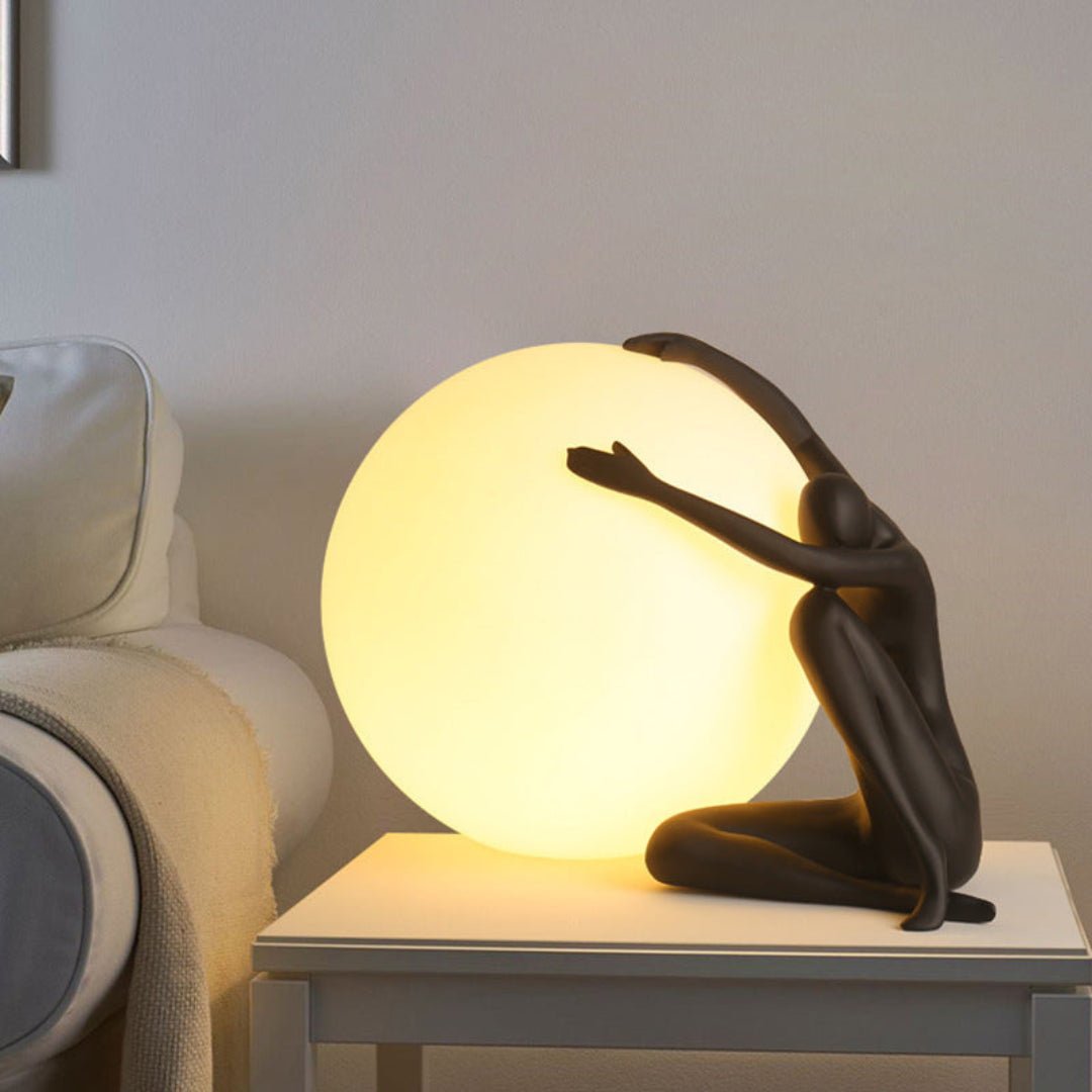 Cosmo Humanoid Ball Holding Table Lamp-Neutral Decor