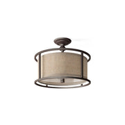 Addyson Ceiling Lamp with antique brass finish and fabric shade.