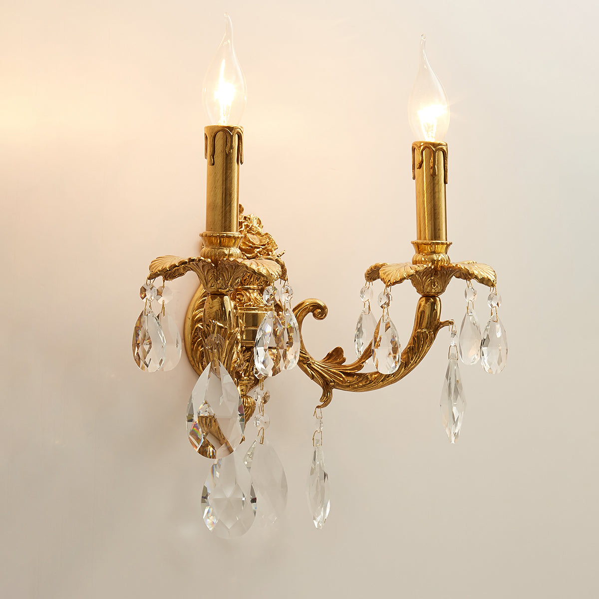 The elegant curved arm of the Adriana brass lamp.