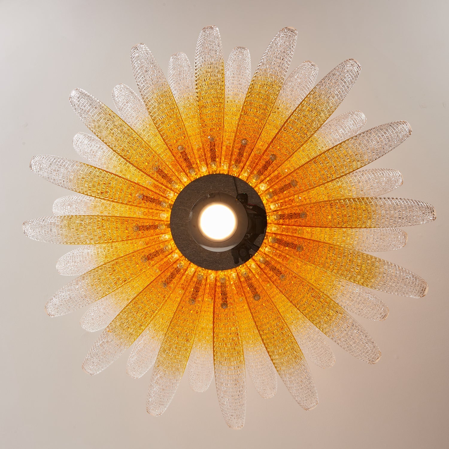 Agave Starburst Chandelier in a modern living room setting.
