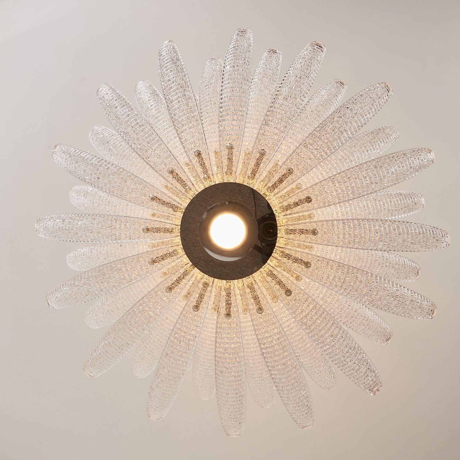 Agave Starburst Chandelier shown in the vibrant purple glass color option.