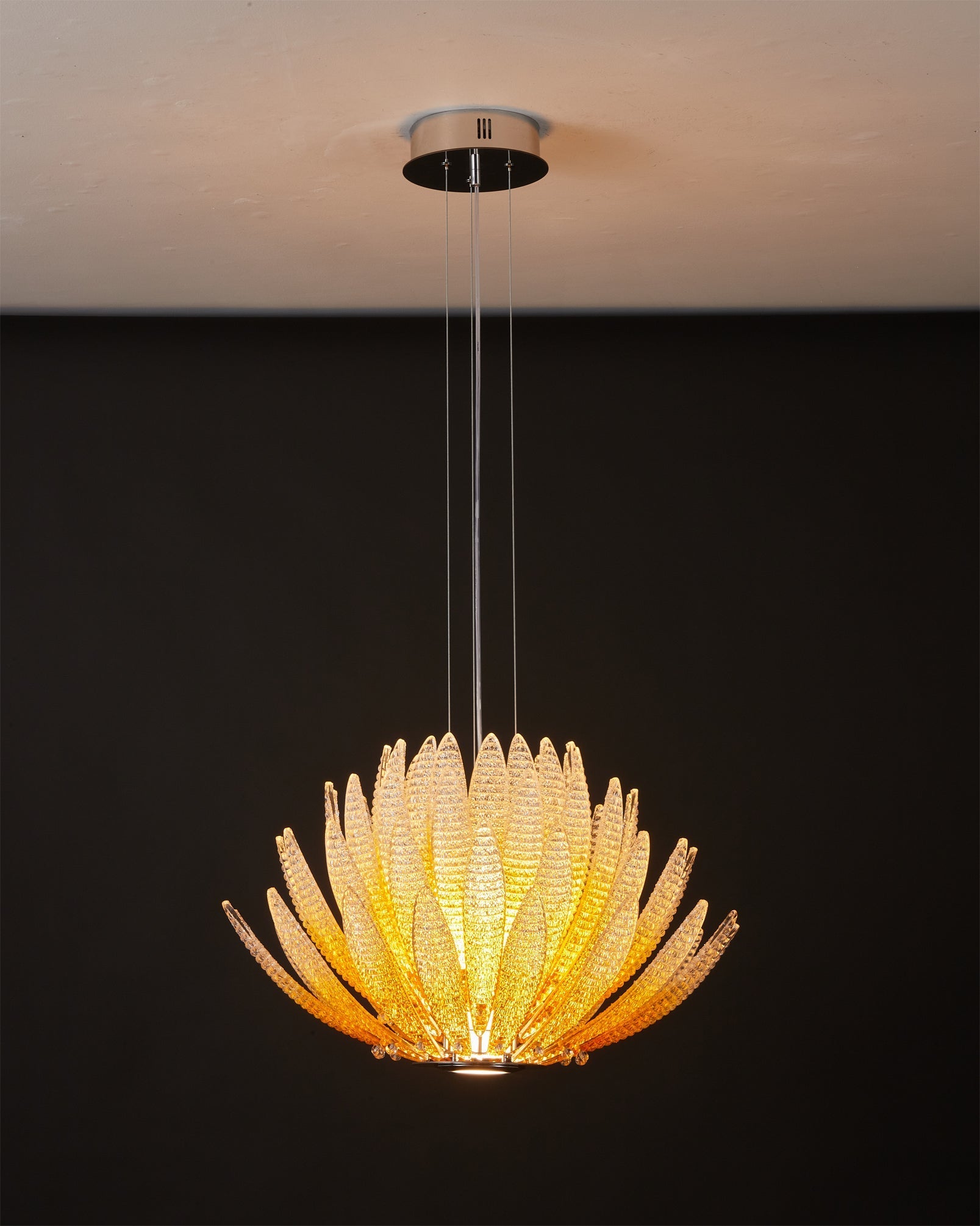 Agave Starburst Chandelier hanging elegantly over a dining table.