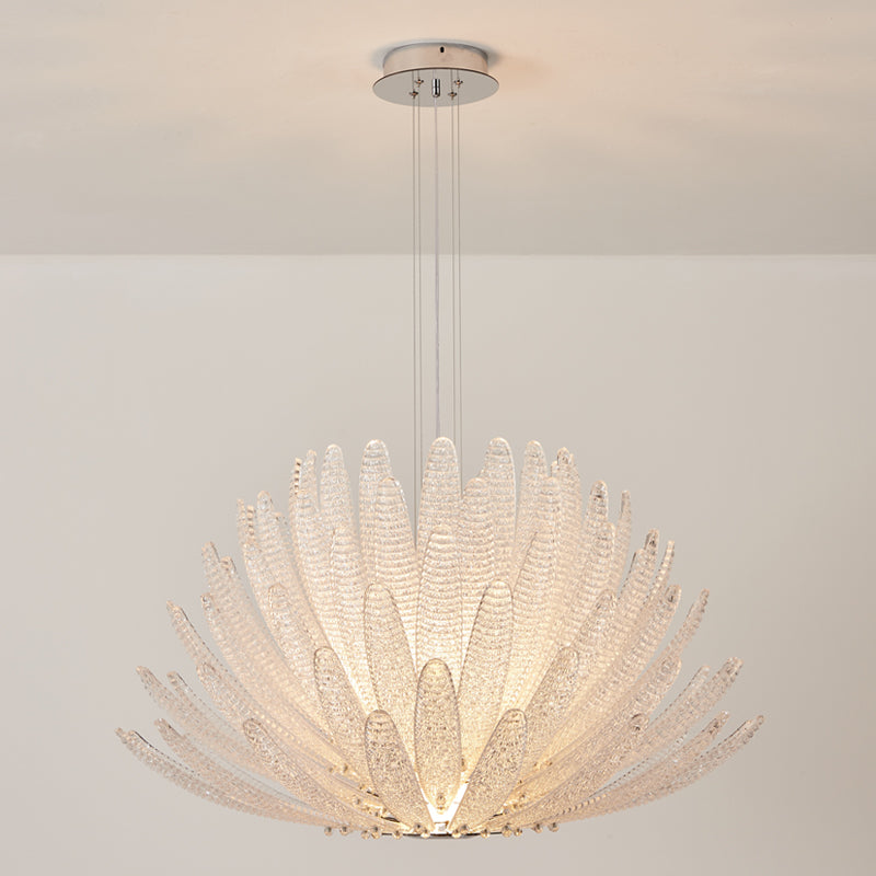 The clear glass Agave Chandelier as a centerpiece in a minimalist room.