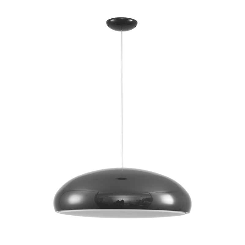 The green Aicia Pendant Light adding a pop of color to a bedroom.