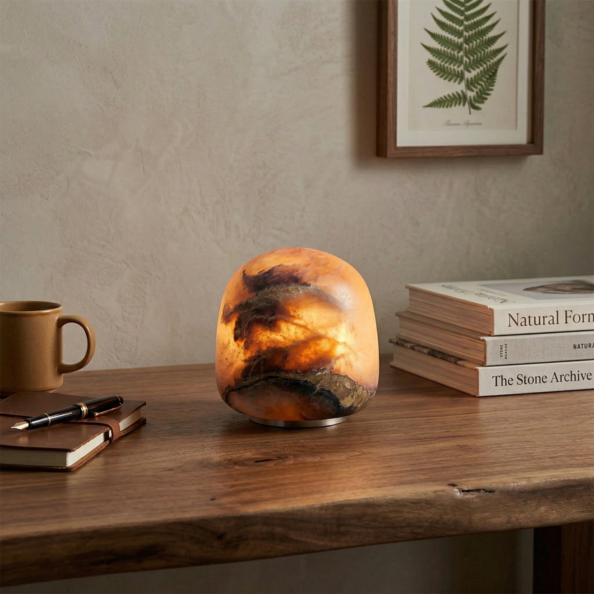 The cordless alabaster lamp on a bedside table creating a cozy ambiance.