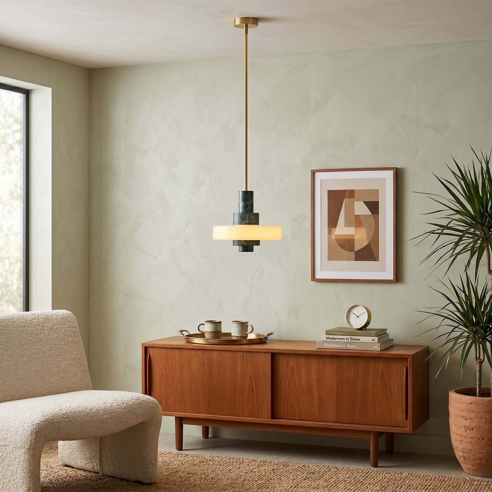 Mercury pendant lamp shown over a kitchen island.