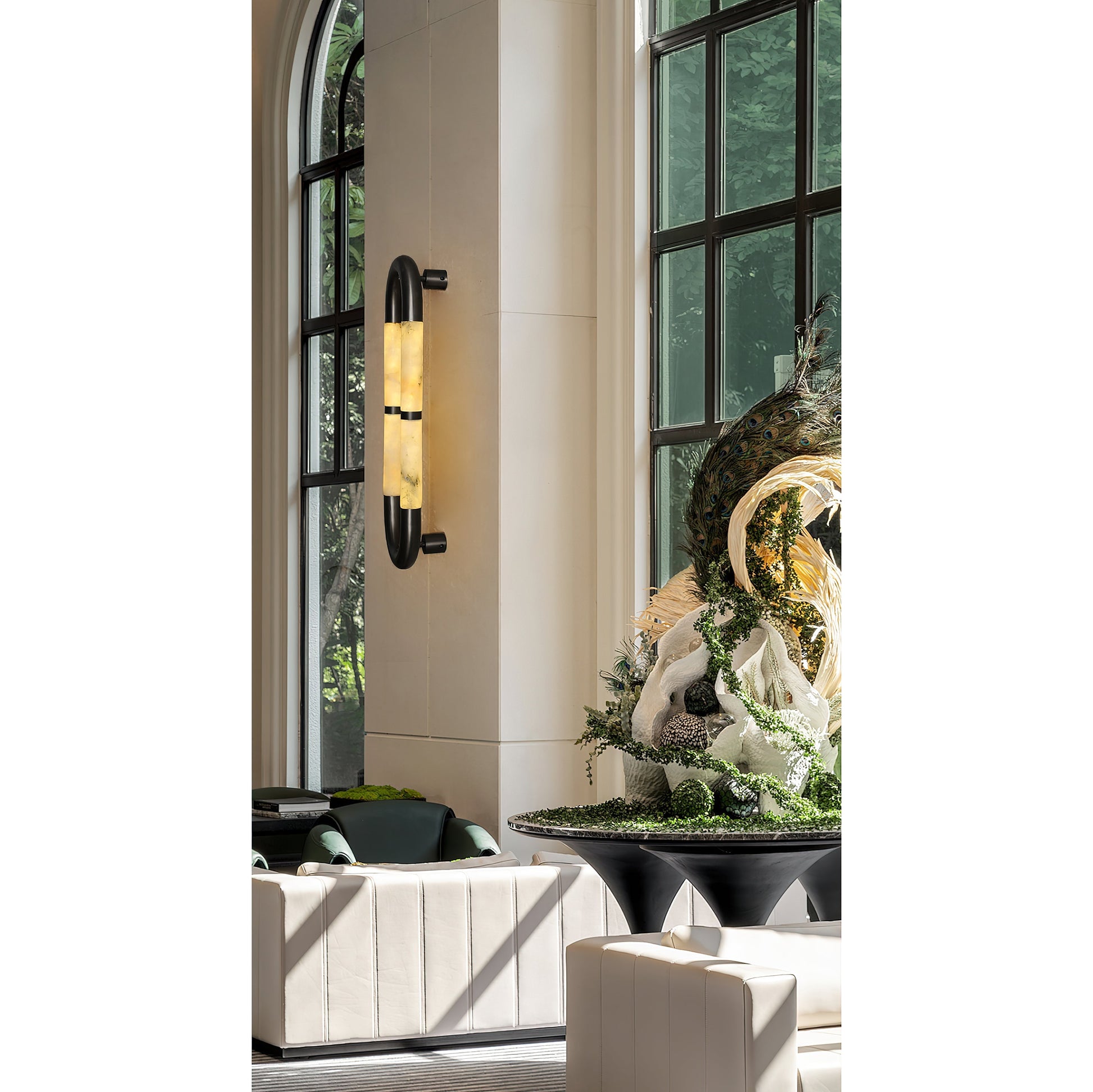 Lifestyle image of the sconce in a contemporary living room.