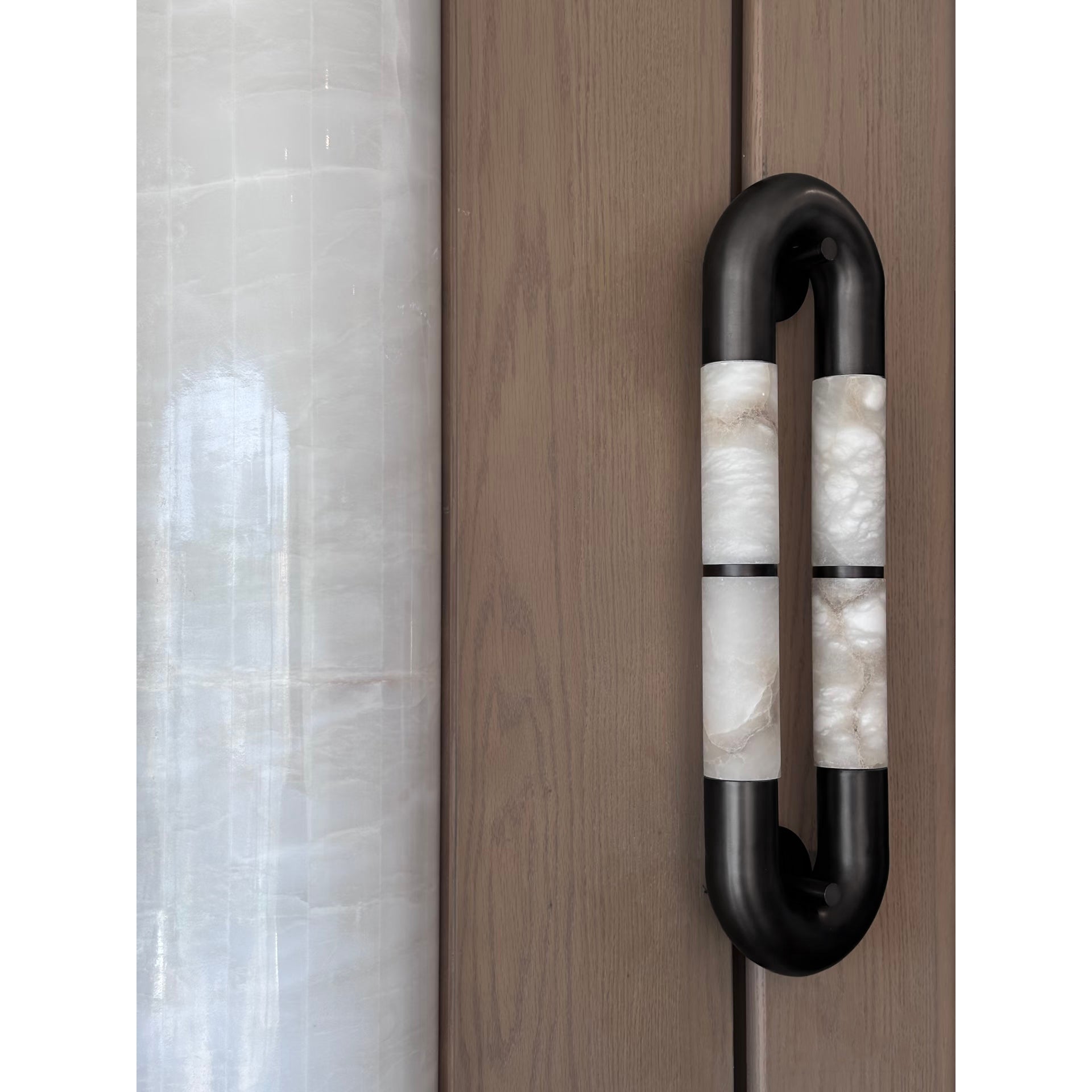 Angled view of the white sconce.