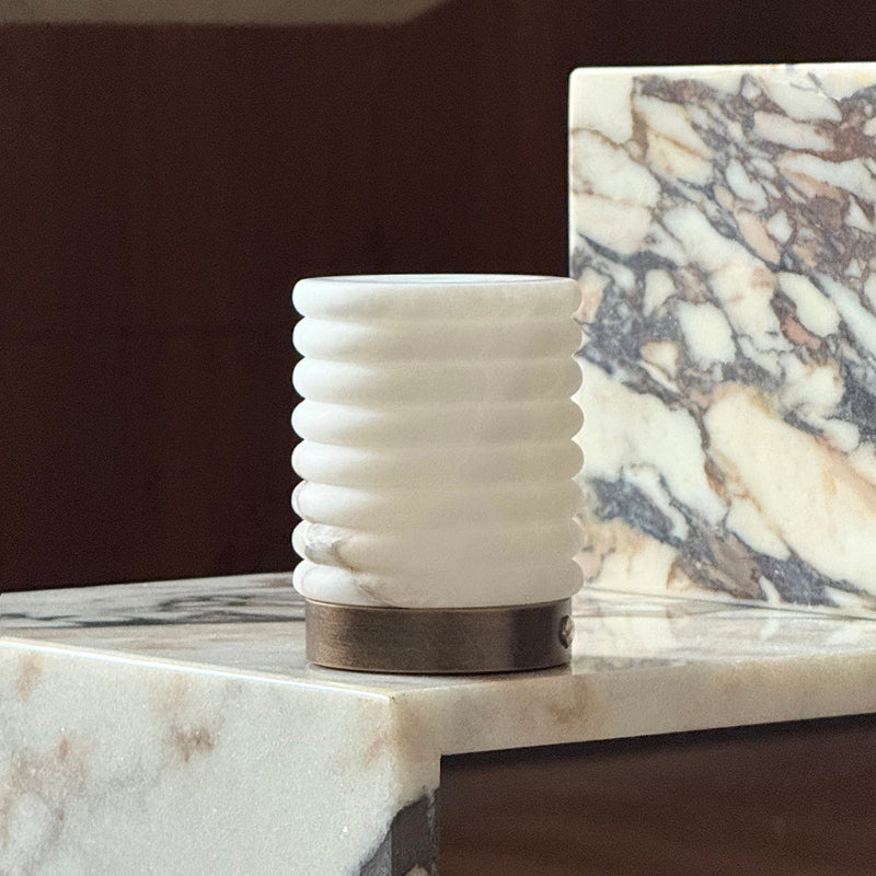 The Alabaster Petite lamp turned off, showing the stone in natural light.