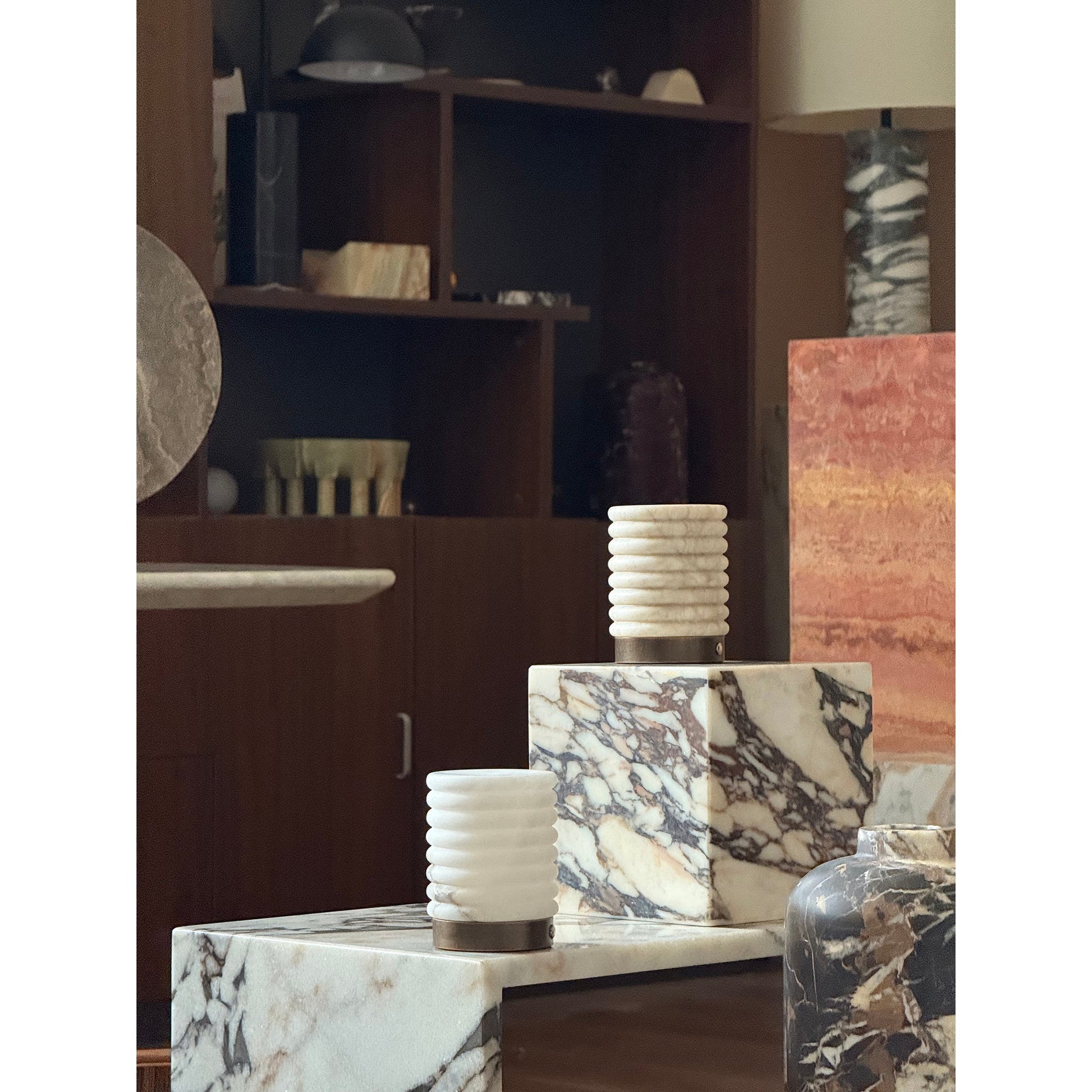 Side view of the alabaster table lamp showing its cylindrical shape.