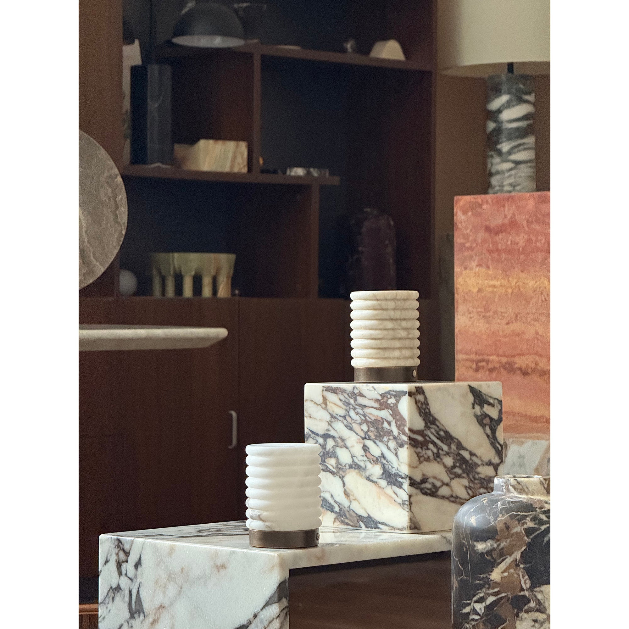 Side view of the alabaster table lamp showing its cylindrical shape.