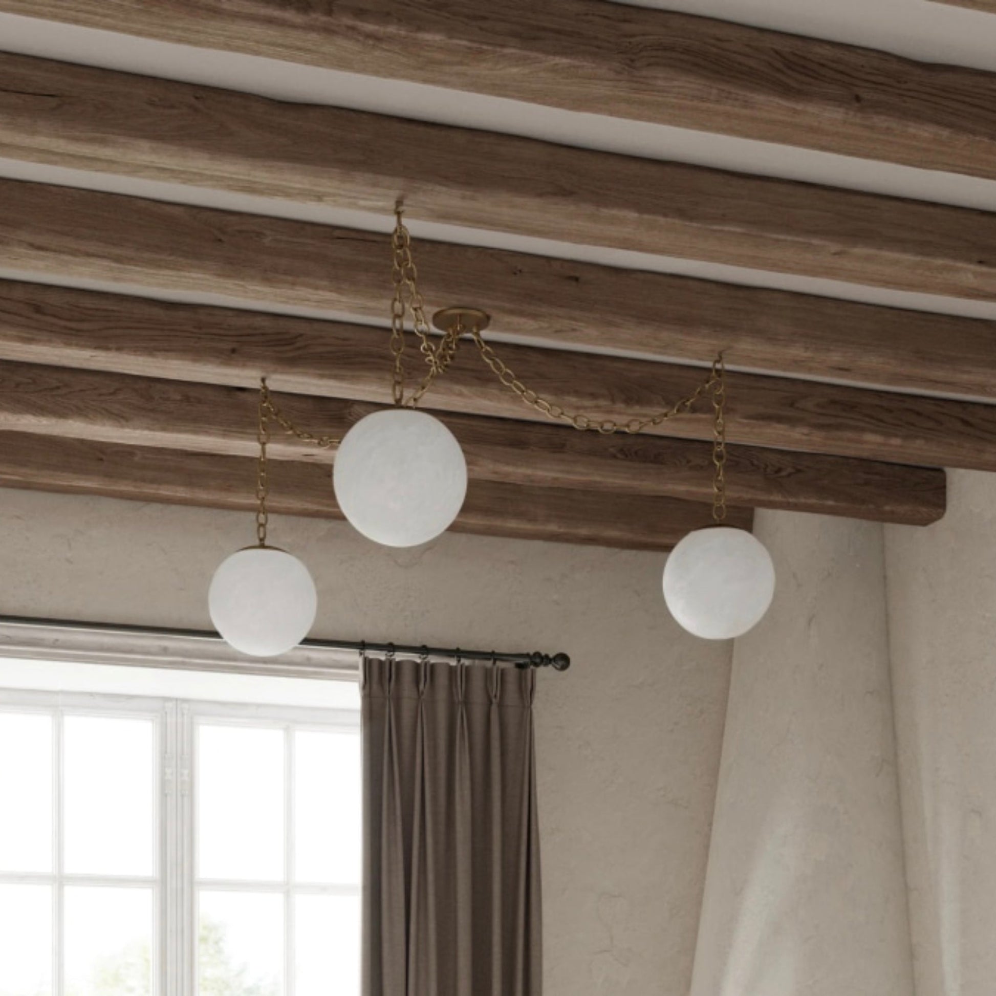 The Alabaster Swag Pendant Lamp with three globes.