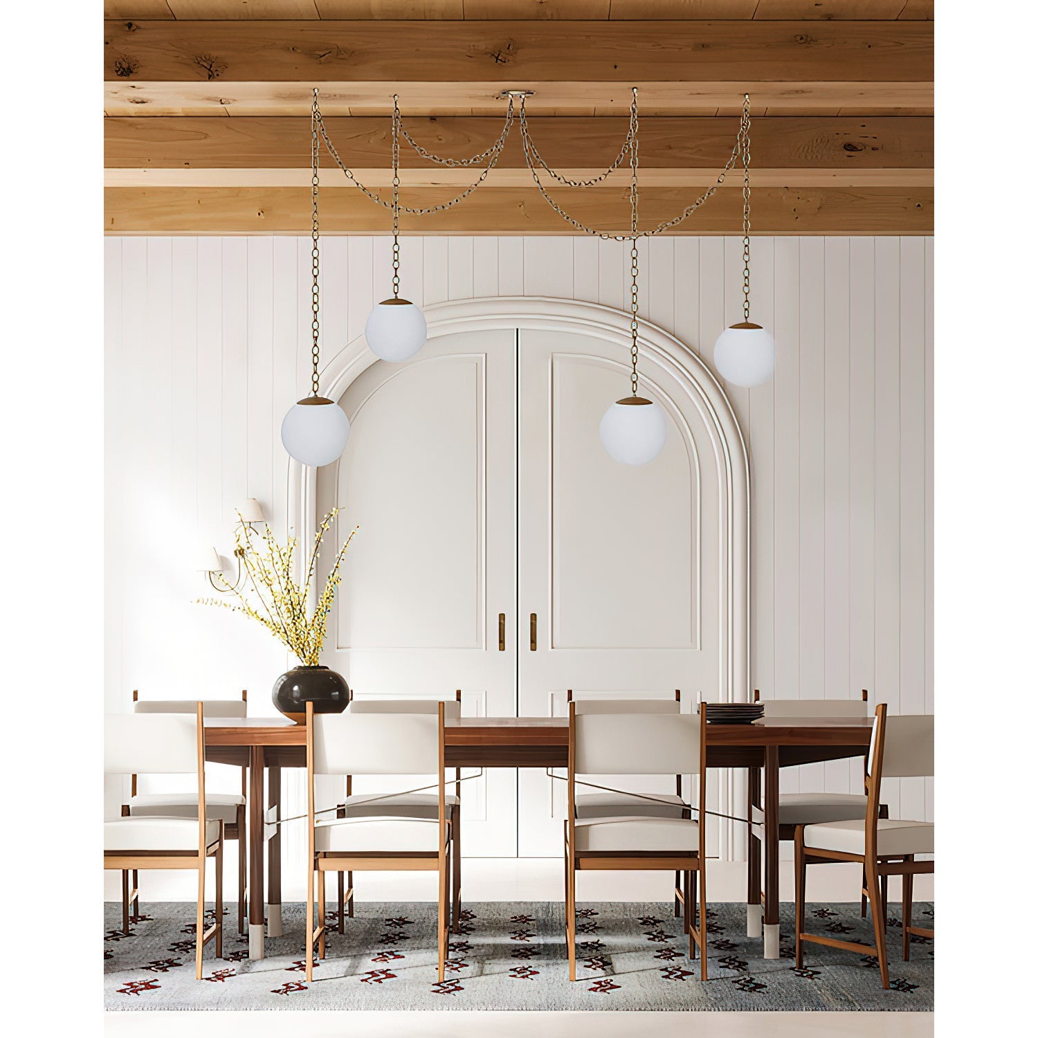The swag pendant lamp against a dark wall to emphasize its glow.