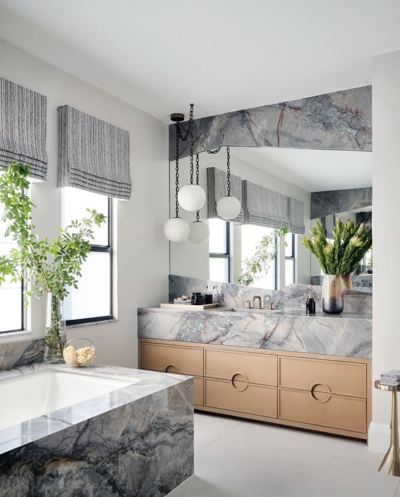 A wide shot of a room featuring the Alabaster Swag Pendant Lamp as a centerpiece.