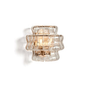 Albano Wall Lamp in clear glass against a neutral wall.