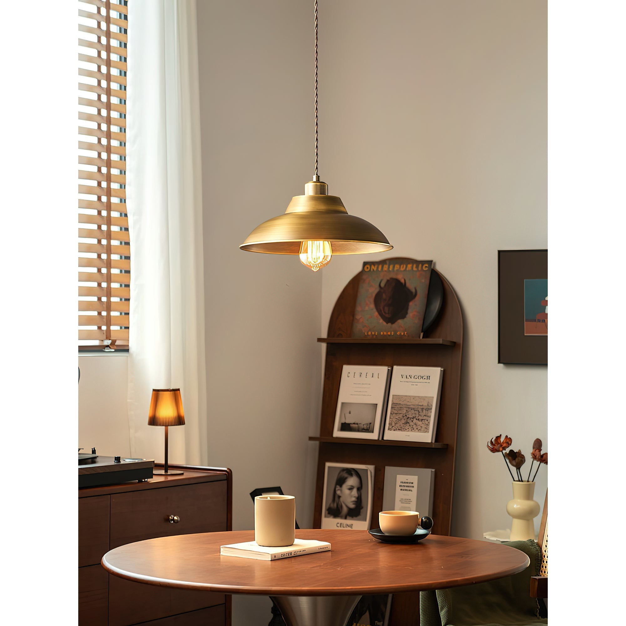 The pendant lamp illuminated, casting a warm and inviting glow.