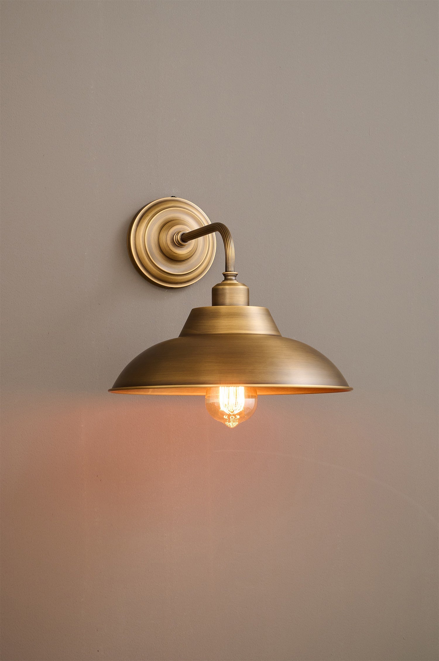 Aldorno Wall Sconce in a minimalist interior setting.