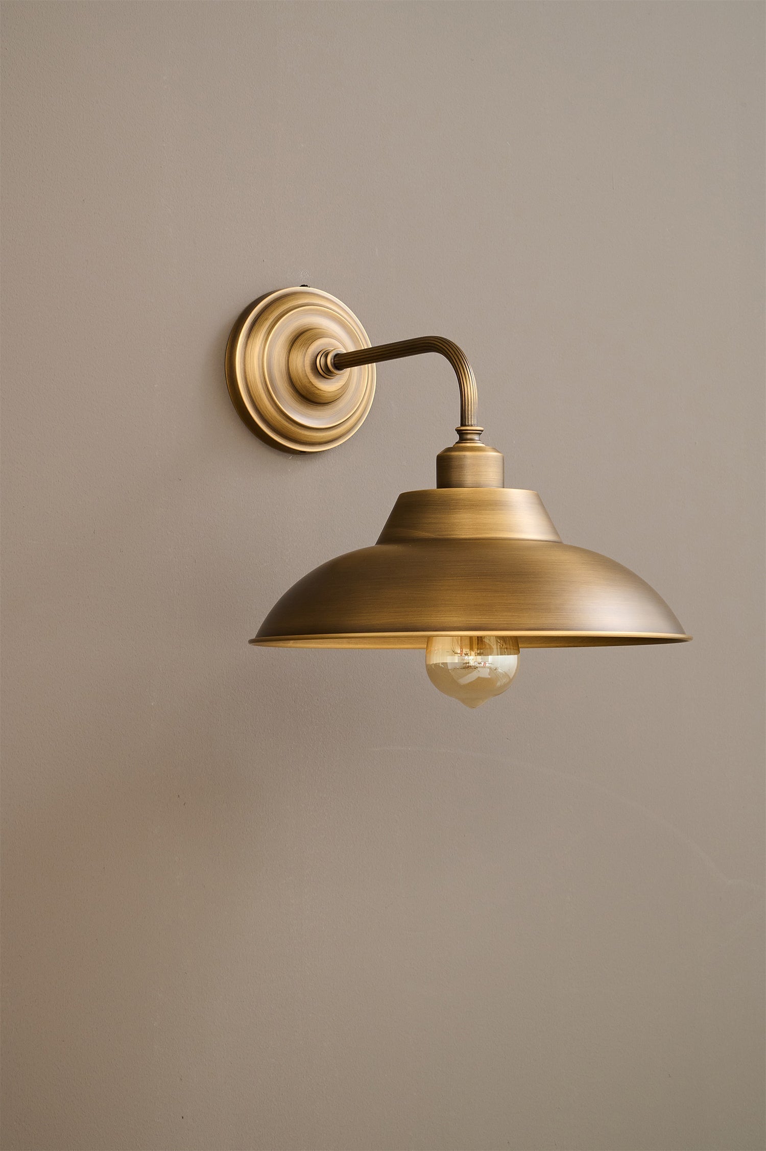 Close-up of the wall mounting plate of the Aldorno Sconce.