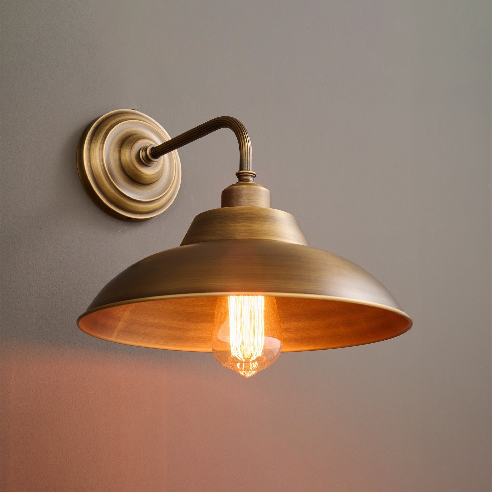 Aldorno Wall Sconce from a low angle, emphasizing its form.