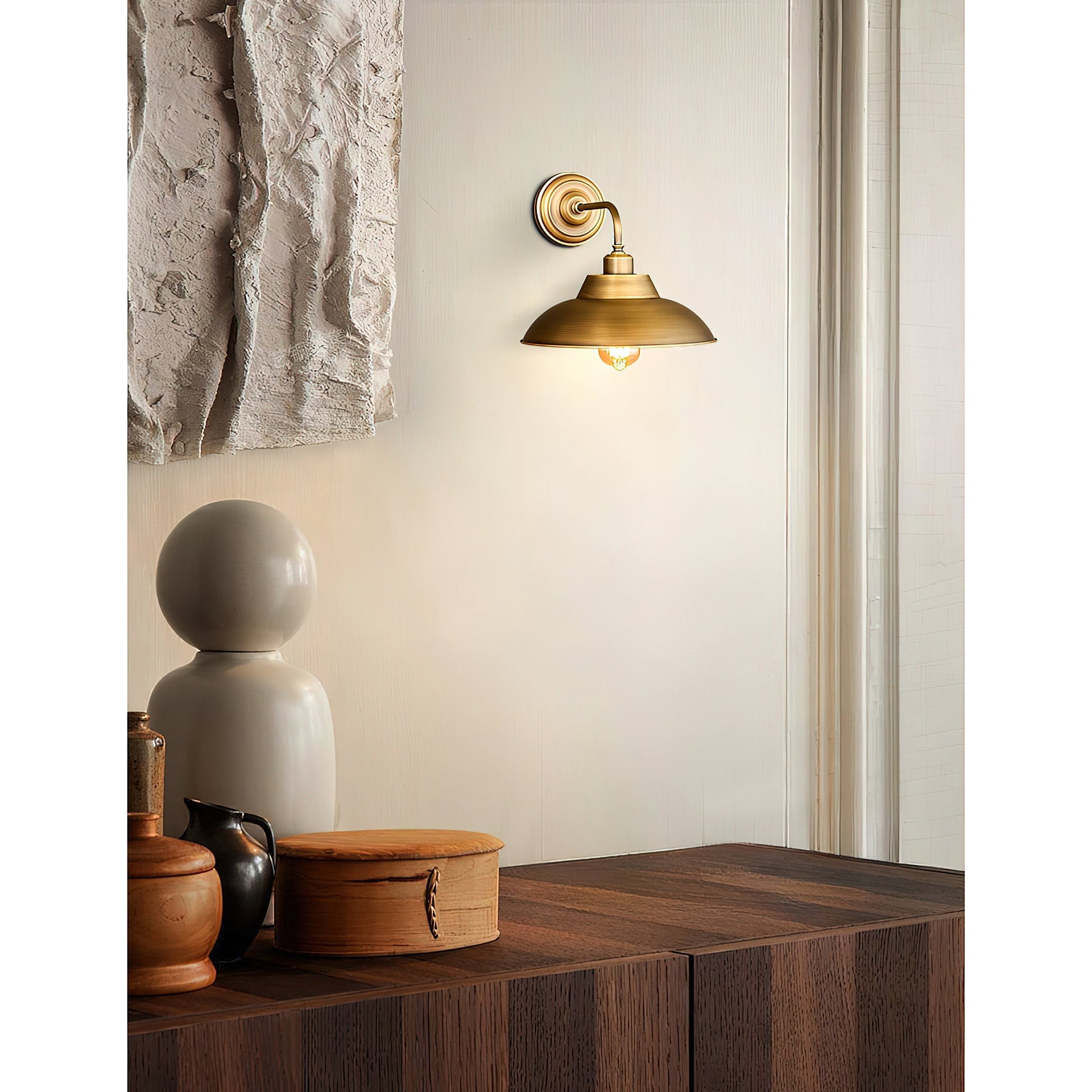 Angled view of the Aldorno Wall Sconce highlighting its curvature.