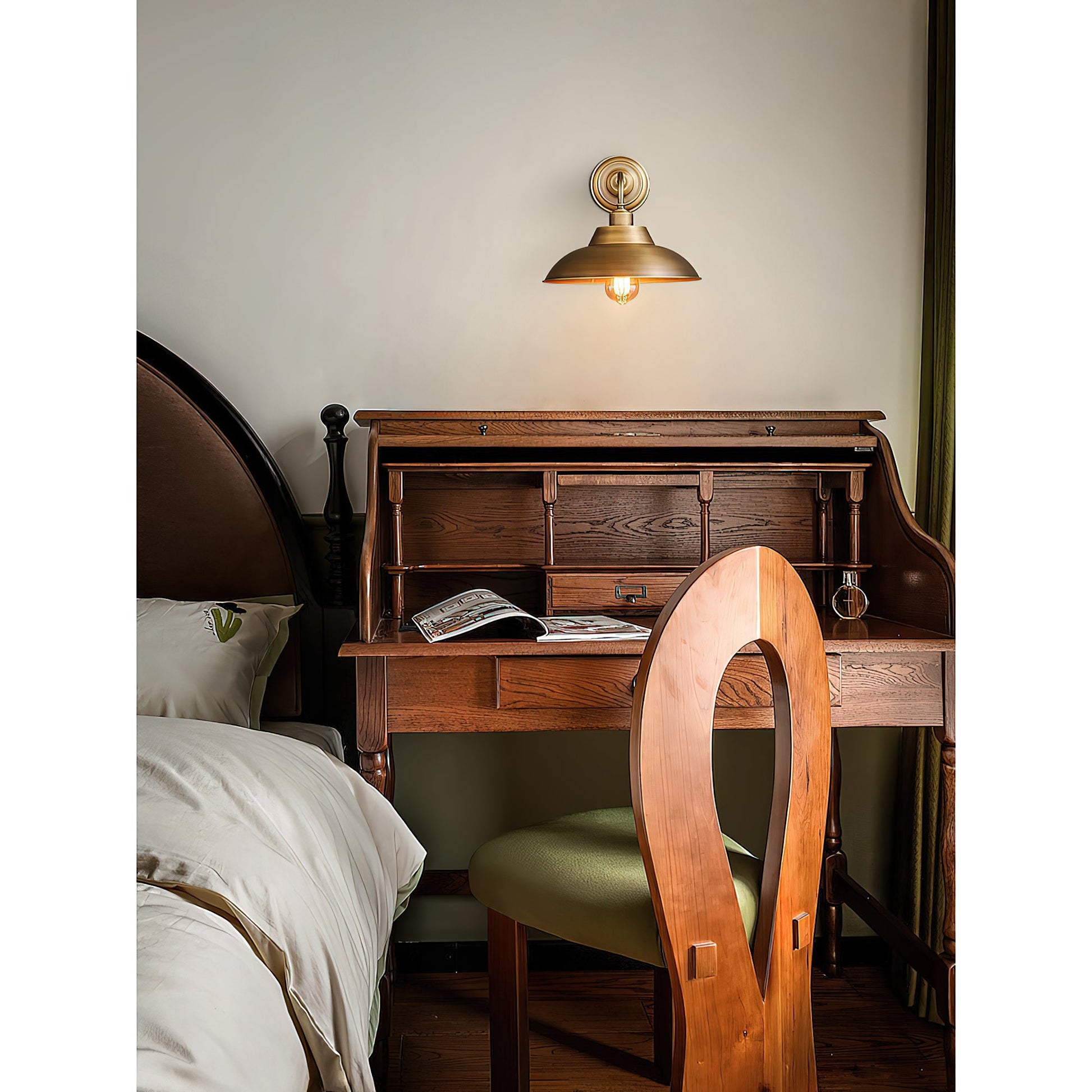 Aldorno Wall Sconce shown with light on, casting a warm glow.
