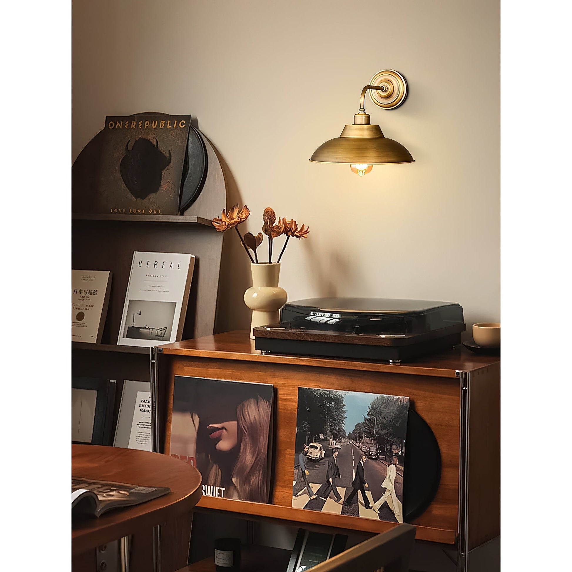 Aldorno Wall Sconce mounted above a bedside table.