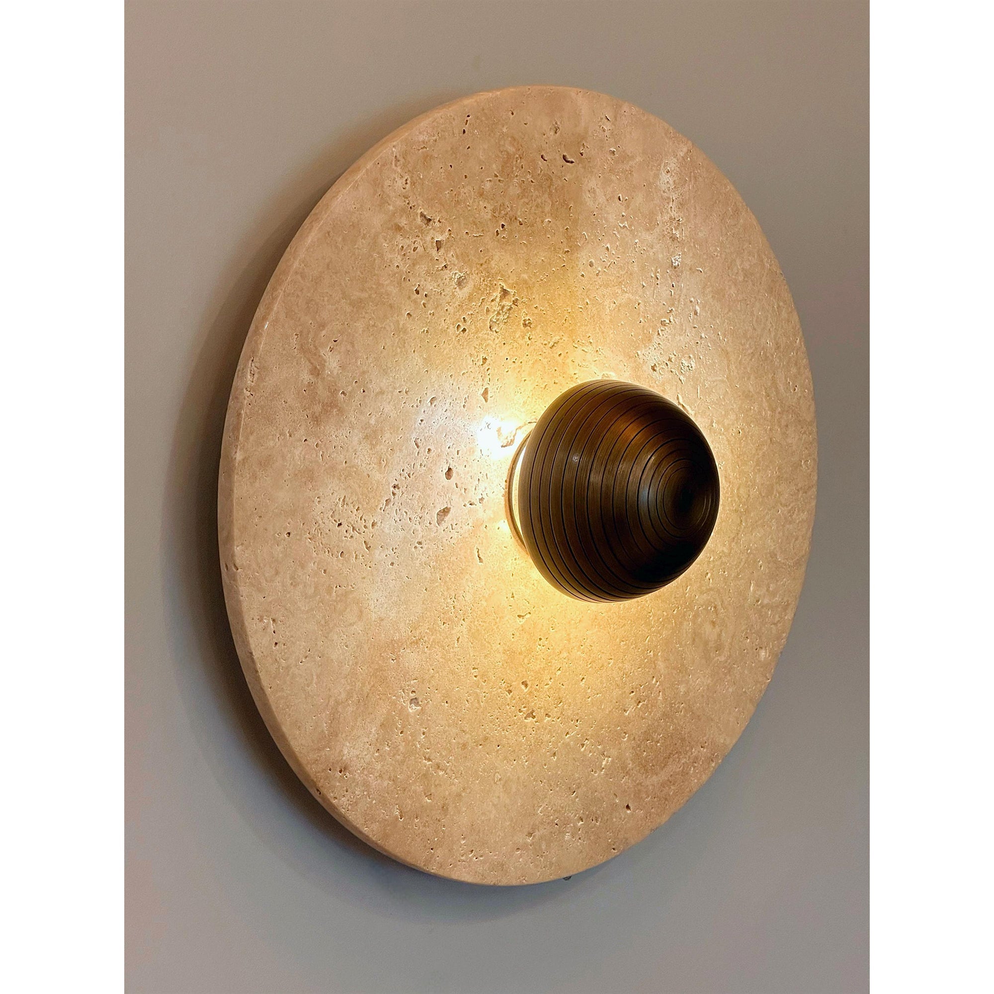 The Alese Wall Lamp styled in a minimalist living room setting.