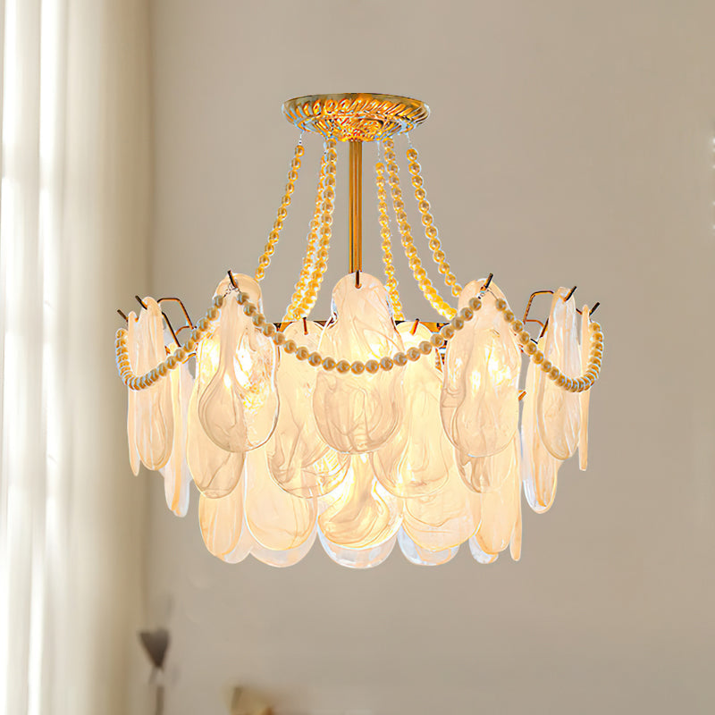 The Alessia Chandelier as a centerpiece in a luxurious bedroom.