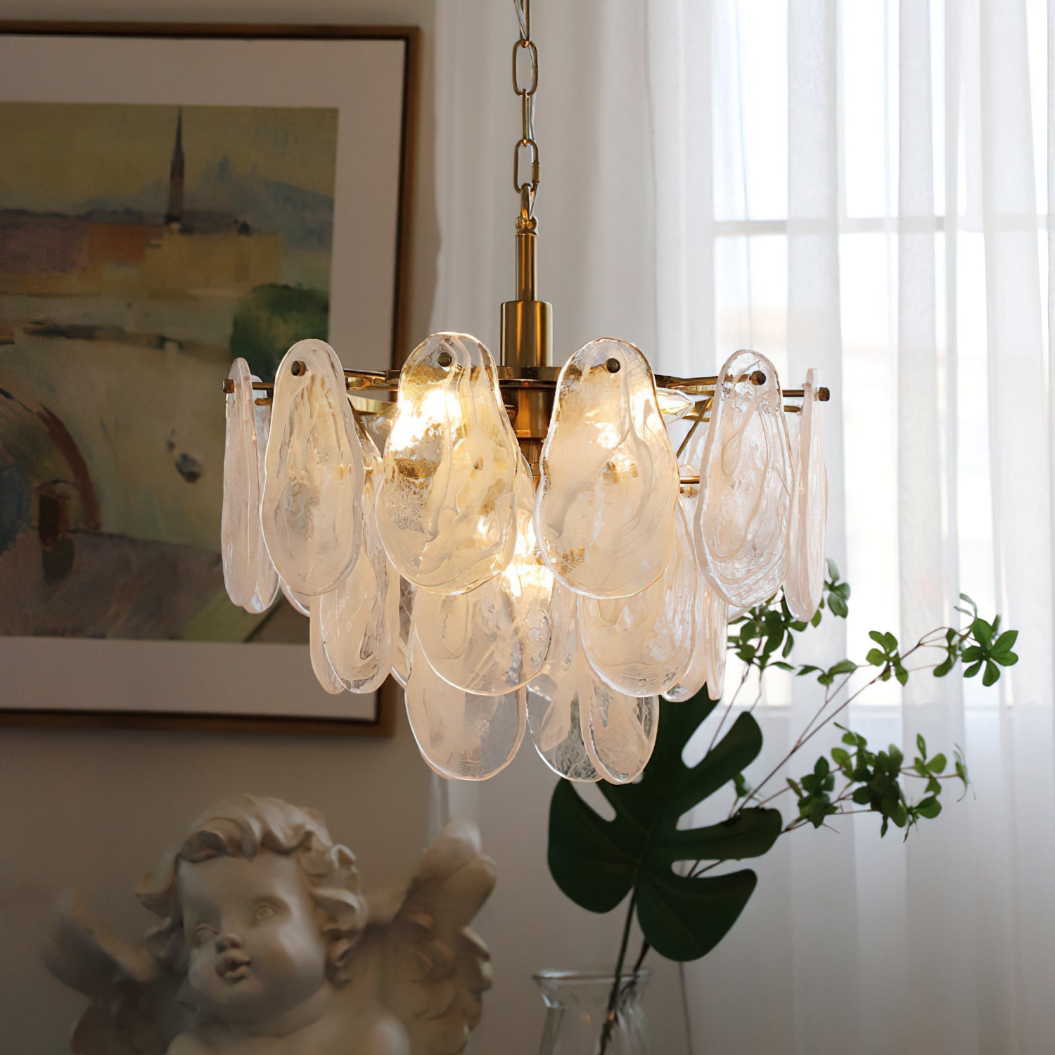 Side profile of the tiered Alessia Glass Chandelier against a dark wall.