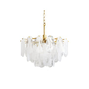 Alessia Glass Chandelier with gold finish, shown in a modern living room.