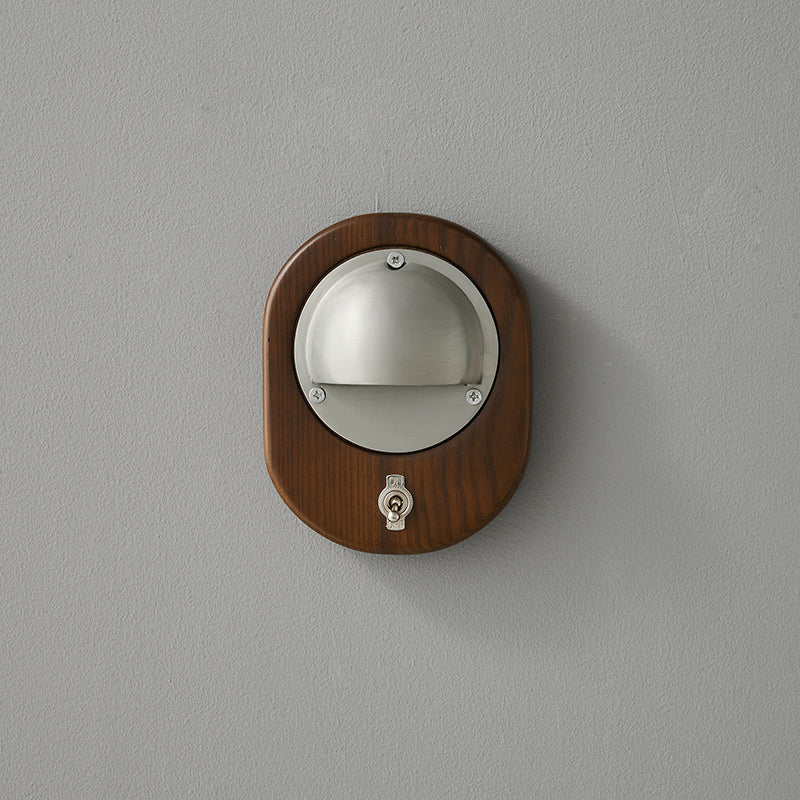 Alfi Wall Lamp illuminating a piece of art on the wall.