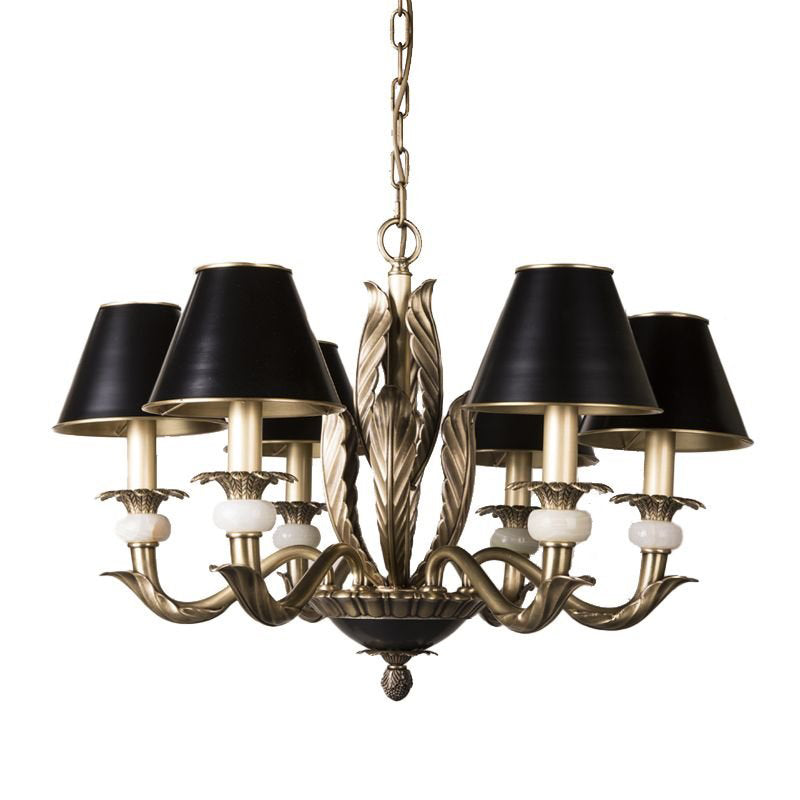 Lifestyle image showing the chandelier above a traditional wooden dining table.