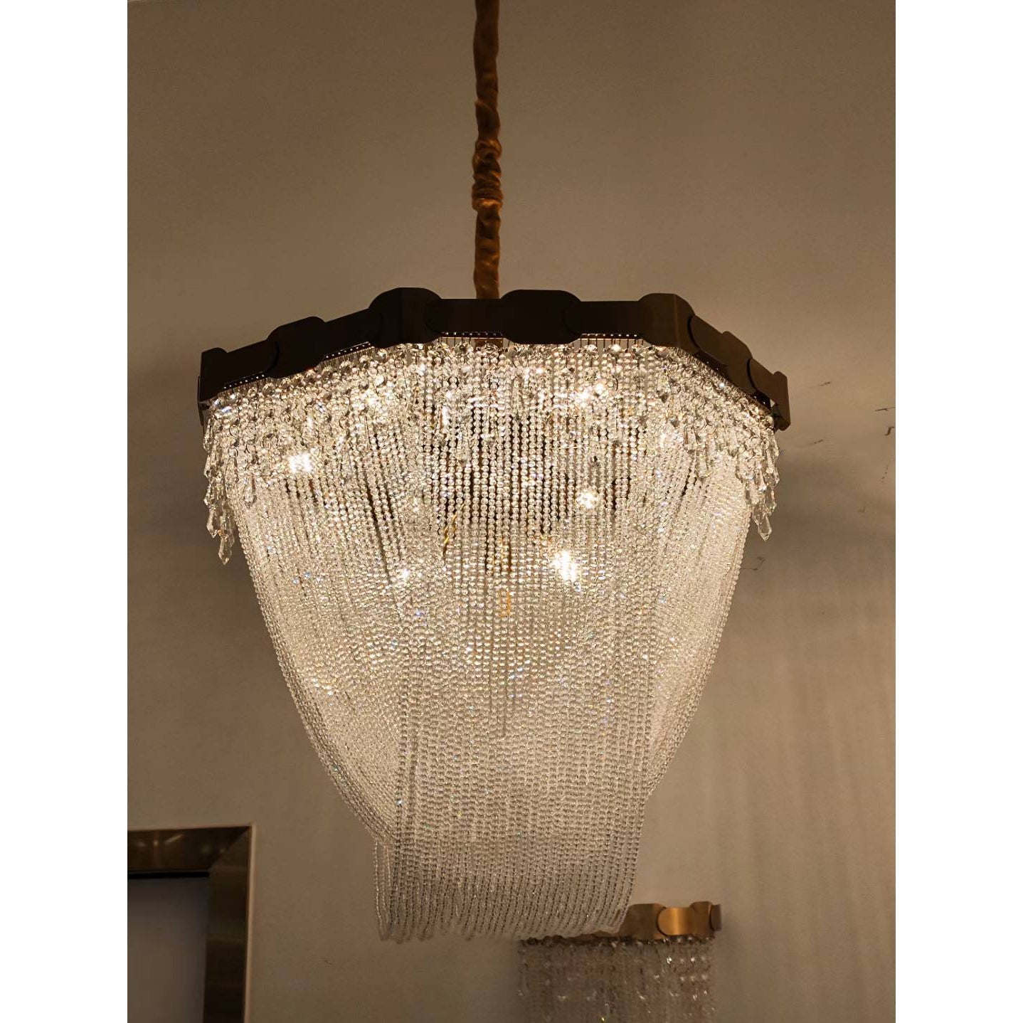 Lifestyle image of the chandelier in a grand entryway.