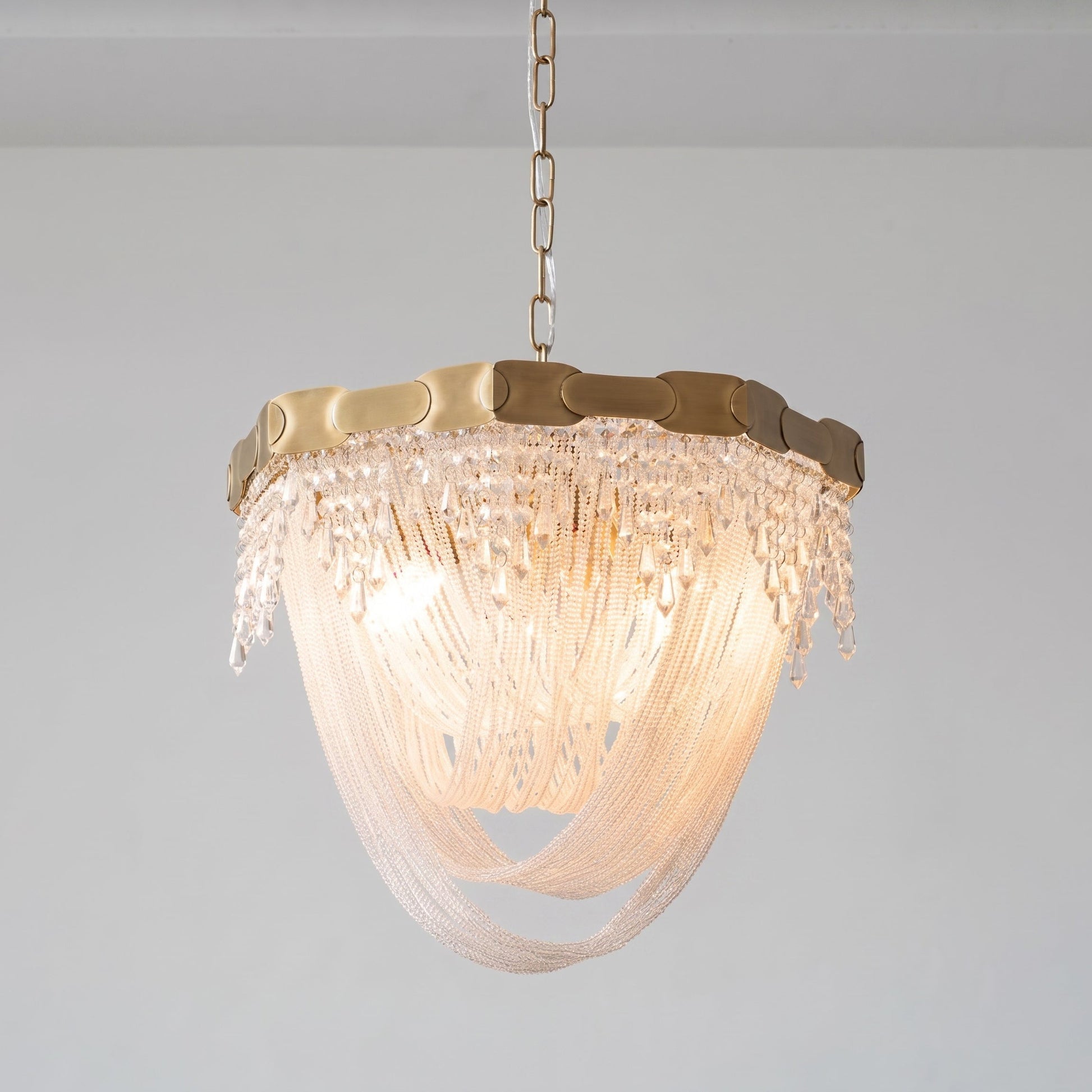 Another angle of the chandelier in a luxurious bedroom setting.