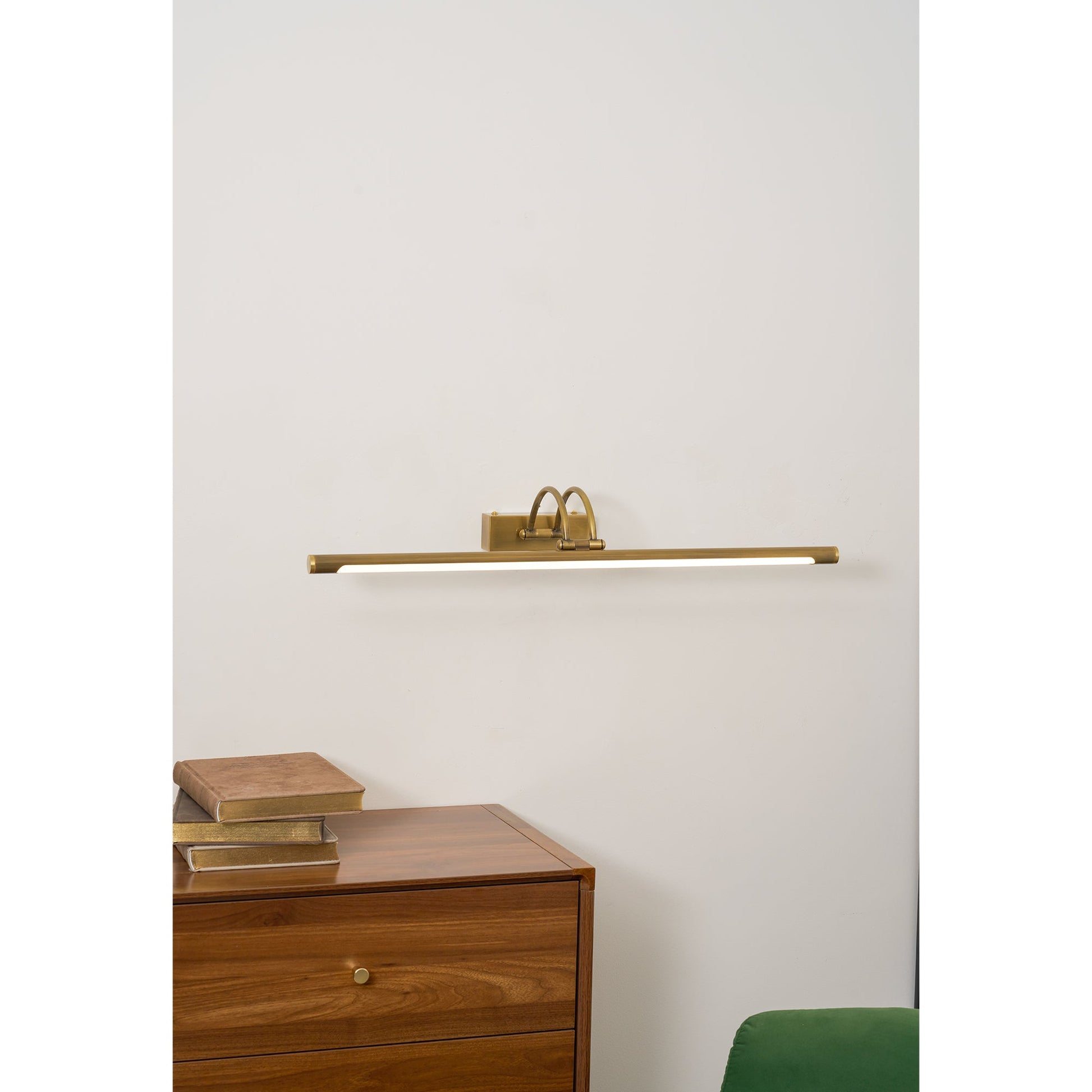 Alton wall lamp shown with its remote control.
