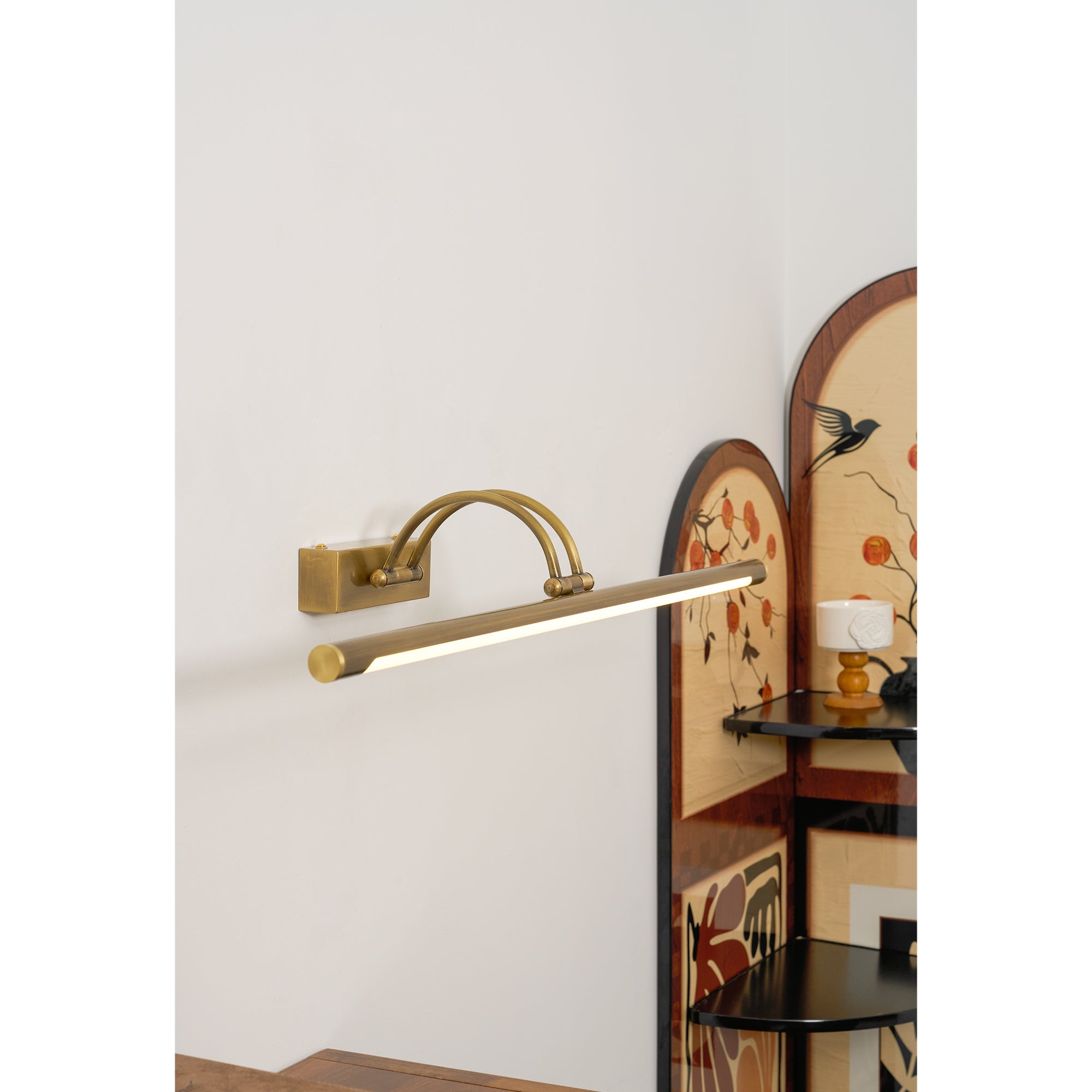 Detail of the antique brass finish on the Alton wall lamp.