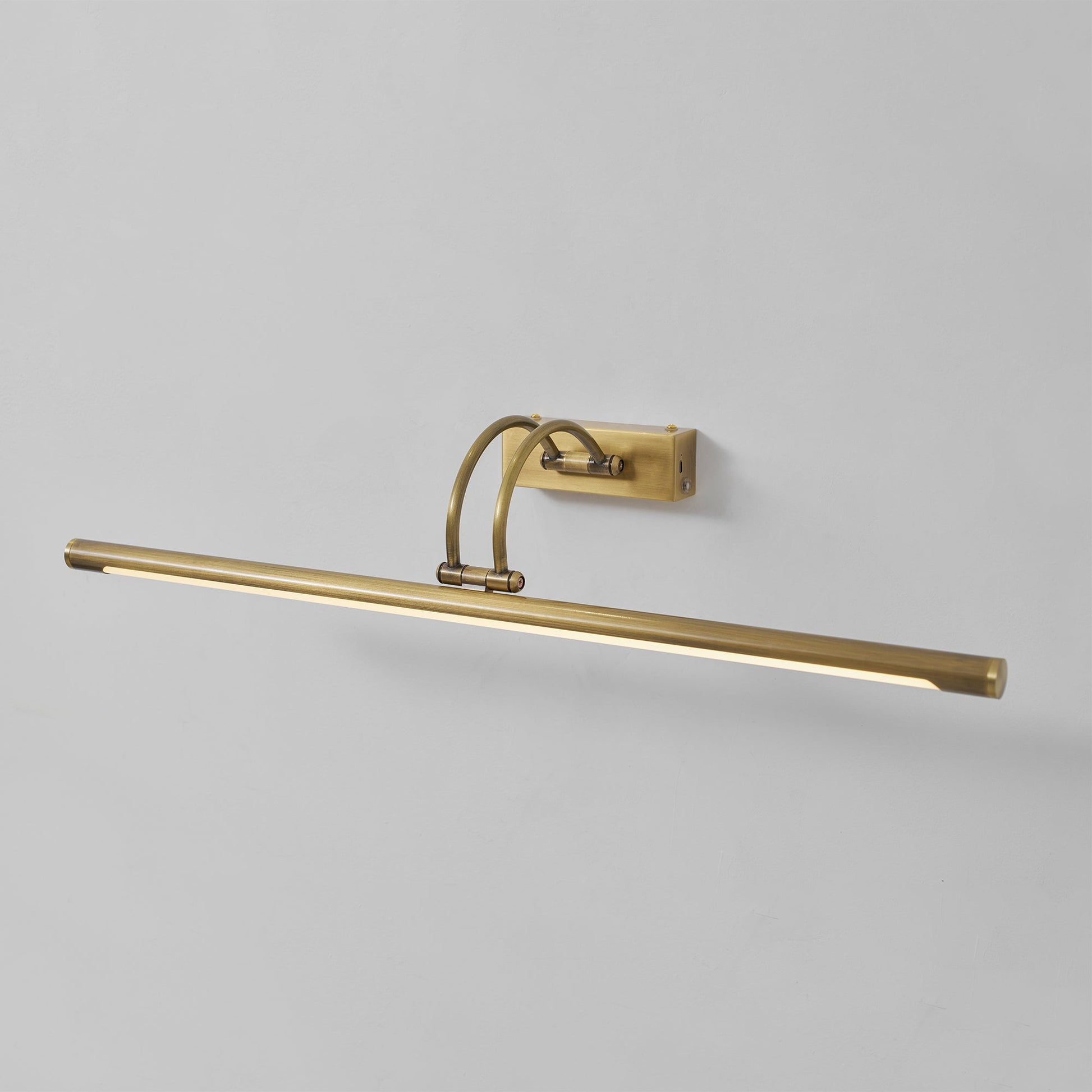 Alton rechargeable wall lamp in antique brass finish, angled view.