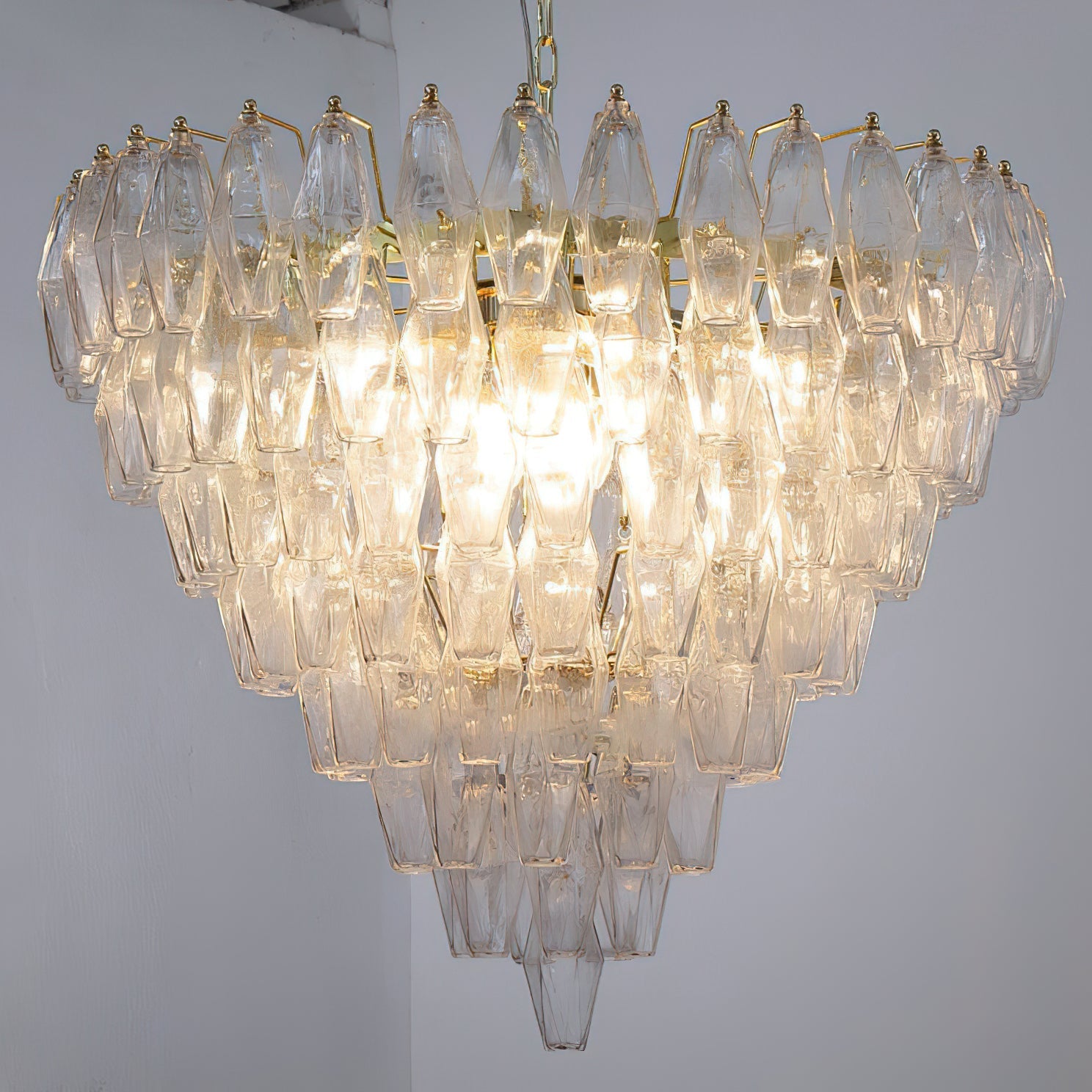 Ametista Chandelier with amber glass prisms in a luxurious lounge.