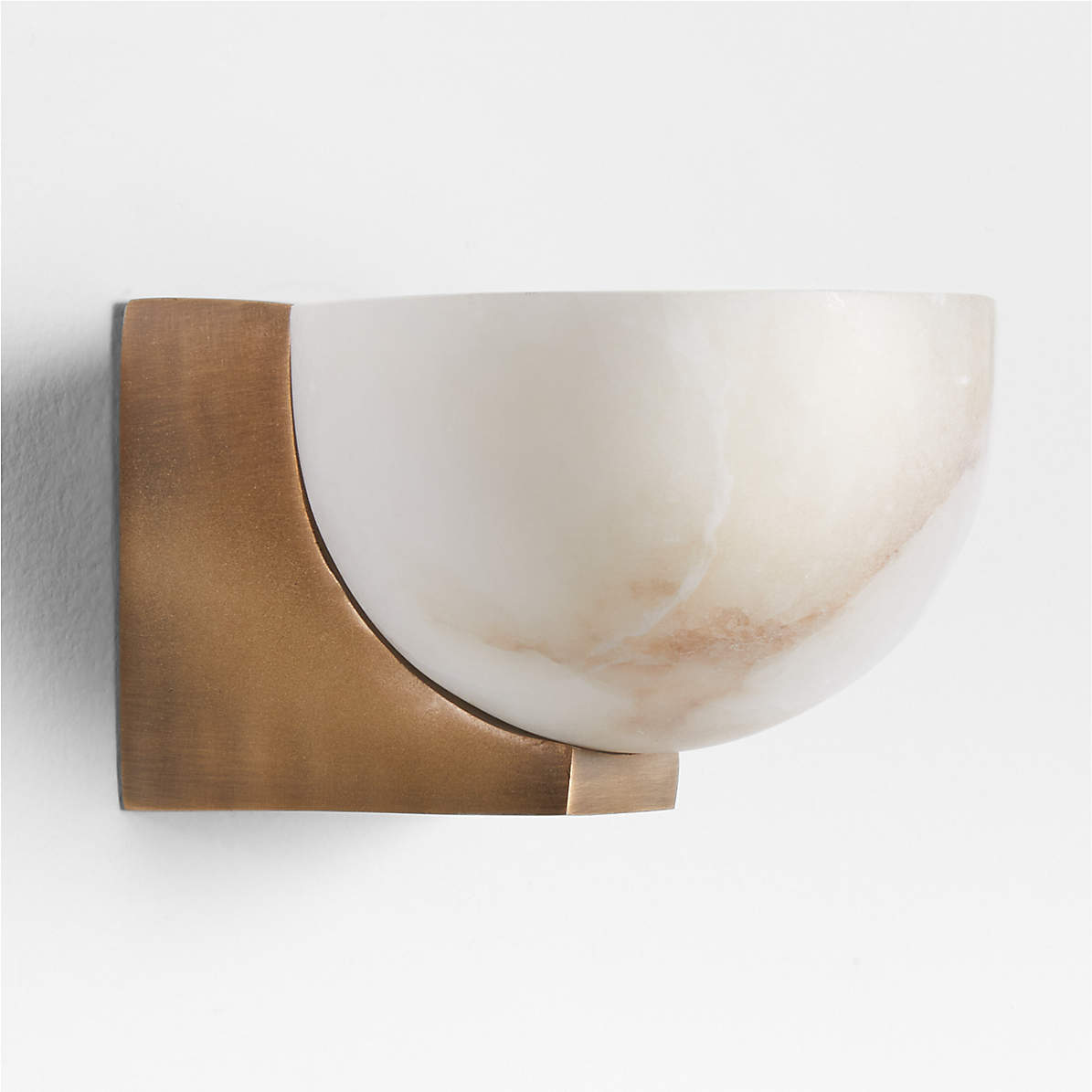 Lifestyle image showing the Ando Sconce in a contemporary bedroom setting.