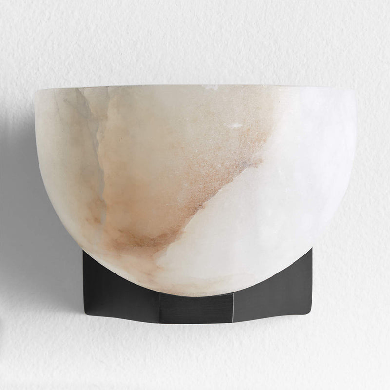 The globe-like alabaster shade shown unlit to display its material beauty.