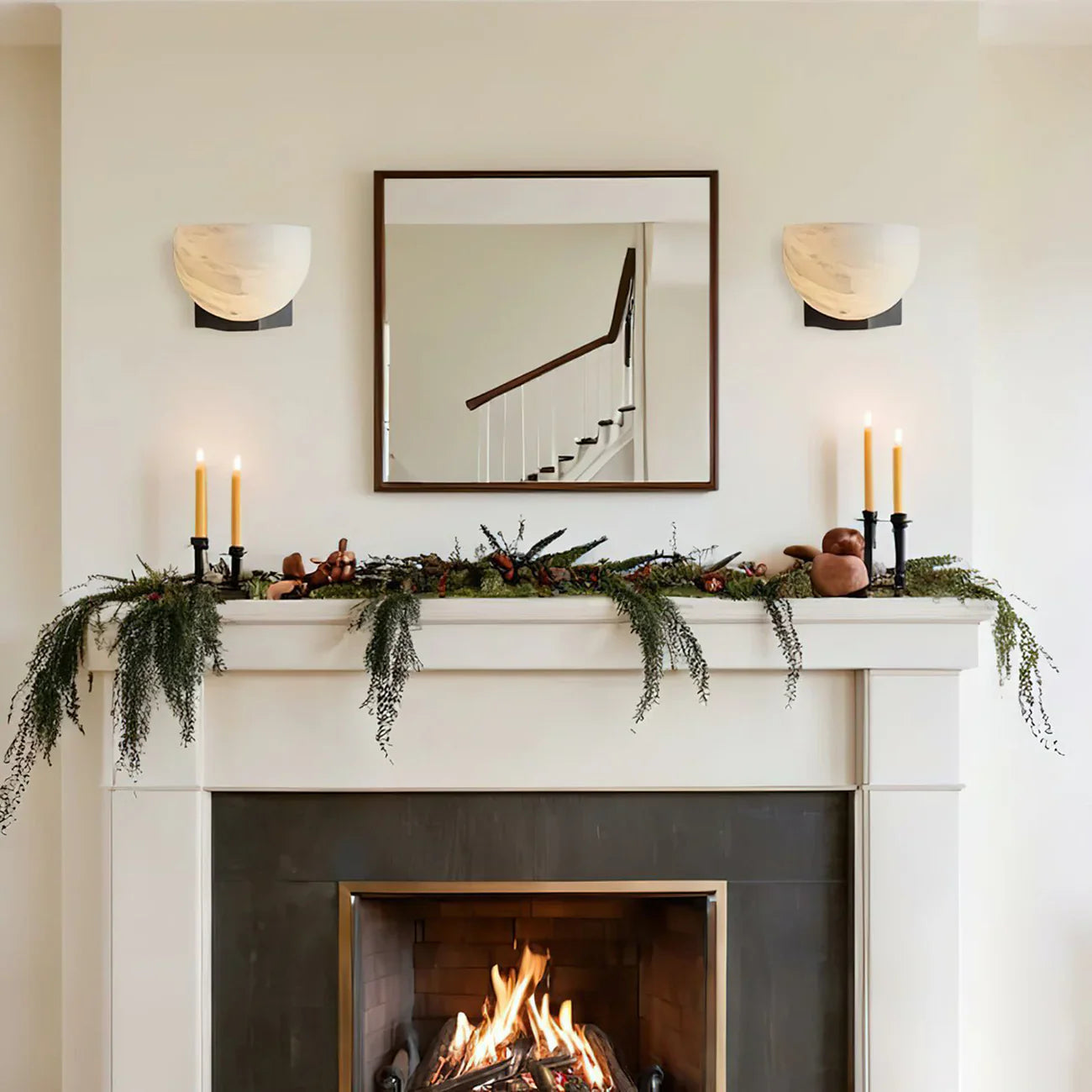 Ando Sconces featured above a fireplace mantel in a living room.